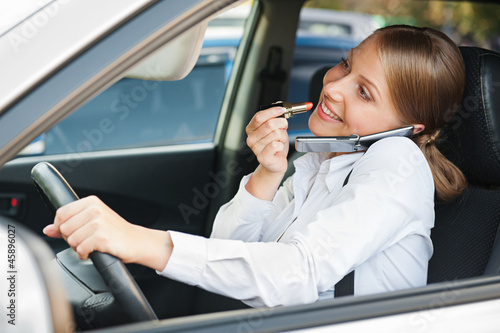 Photo: frivolous woman driving the car frivolous woman driving the car