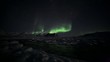 Aurora Borealis over the frozen Arctic fiord