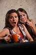 Surprised Woman with Whispering Friend