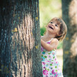 One year little girl playing in the park portrait.