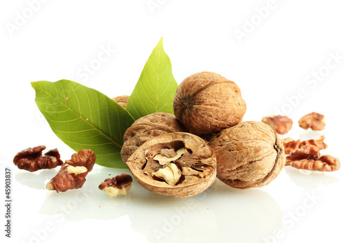 Photo: walnuts with green leaves, isolated on white walnuts with green leaves, isolated on white