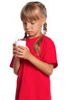Little girl with glass of milk