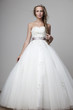 beautiful smiling girl in a white wedding dress
