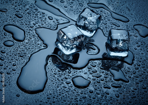 Photo: Ice cubes over dark background Ice cubes over dark background