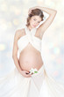 Pregnant woman holding her belly