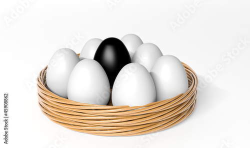 Illustration: Black egg among white eggs in the basket Black egg among white eggs in the basket