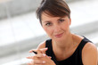 Portrait of attractive businesswoman sitting in office
