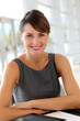 Portrait of smiling businesswoman sitting at desk