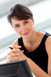 Portrait of attractive businesswoman sitting in office