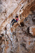 Female rock climber on a cliff face