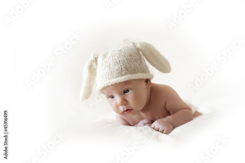 Photo: cute newborn baby bunny in the cap cute newborn baby bunny in the cap