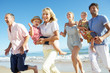 Multi Generation Family Enjoying Beach Holiday