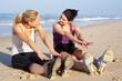 Two Women Exercising On Beach