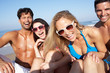 Photo: Group Of Friends Enjoying Beach Holiday Group Of Friends Enjoying Beach Holiday