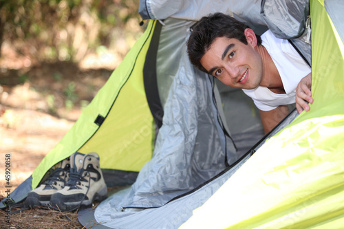 Photo: young man camping young man camping