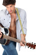 Man playing the guitar on white background