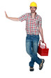 Builder stood with tool box