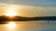 fisherman boats on morning lake with mountain