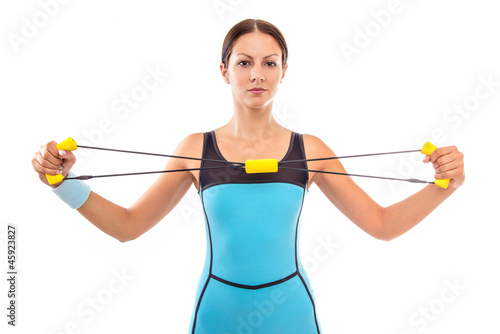 Photo: Fitness woman doing exercise, isolated on white Fitness woman doing exercise, isolated on white