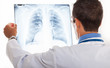 Photo: Doctor examining a radiography Doctor examining a radiography