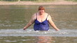 Video: woman with overweight bath in river woman with overweight bath in river