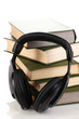 Headphones on books isolated on white