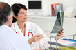 Photo: Patient receiving x-ray results Patient receiving x-ray results
