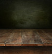 Foto: Old wooden table with dark background Old wooden table with dark background