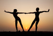 Silhouette of two young women