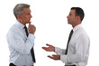 Two businessmen discussing.