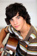 Young man playing a guitar