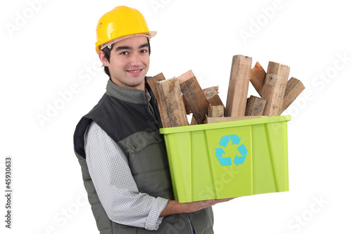 Photo: Man holding recycle box full of scrap wood Man holding recycle box full of scrap wood