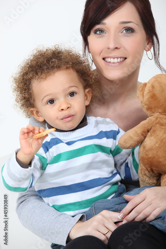 Photo: Woman posing with her kid Woman posing with her kid