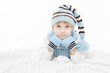 Child in warm winter hat and mittens. Close up portrait