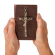 Old hands (woman) holding a very old bible