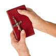 Old hands (woman) holding a very old bible