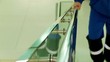 Worker is holding onto a railing when climbing stairs