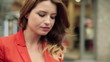 Happy woman eating ice cream in the city, steadicam shot