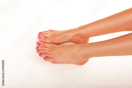 Photo: Female feet with nail varnish Female feet with nail varnish