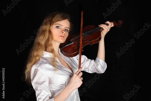 Photo: sexy girl in shirt play on viola in black, dark room, halfbody sexy girl in shirt play on viola in black, dark room, halfbody