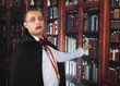 portrait of a handsome young man in a suit of Count Dracula