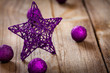red star , gifts and ribbons on weathered wooden board