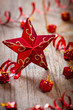 red star , gifts and ribbons on weathered wooden board