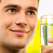 Portrait of happy man with water, outdoor