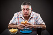 Photo: Greedy man eating burger Greedy man eating burger