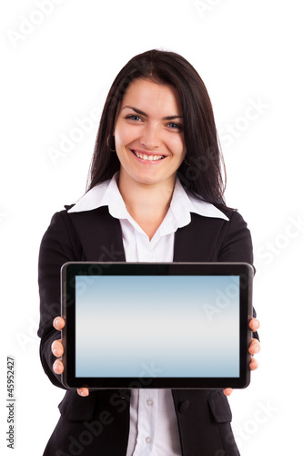 Photo: Young businesswoman showing tablet isolated on white background Young businesswoman showing tablet isolated on white background
