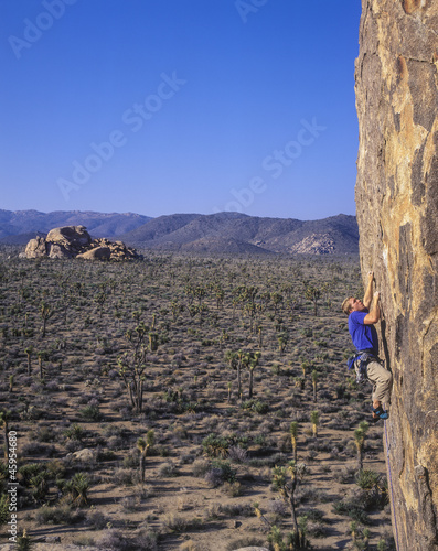 Photo: Climber gripping the rock. Climber gripping the rock.