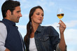Woman with drink next to man