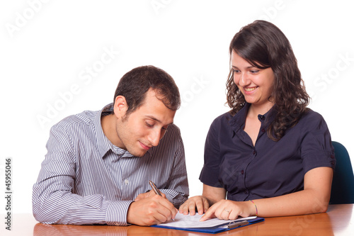 Photo: Financial Consultant and Client Signing Financial Consultant and Client Signing