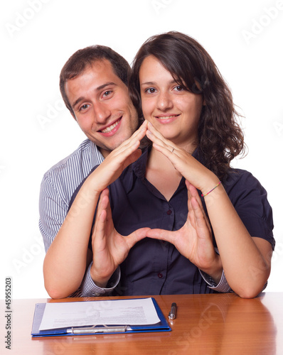 Photo: Happy Young Couple Buying an House Happy Young Couple Buying an House